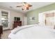 The main bedroom features a leaf-design ceiling fan and a large bed at 81 W Sundance Ct, San Tan Valley, AZ 85143