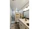 Modern bathroom with a walk-in shower, updated vanity, and stylish fixtures at 8354 E Emelita Ave, Mesa, AZ 85208