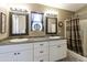Bathroom features dual sinks, decorative mirrors and hardware and a step-in shower at 8354 E Emelita Ave, Mesa, AZ 85208