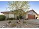 Charming single-story home featuring a tile roof, low maintenance desert landscaping, and warm curb appeal at 8354 E Emelita Ave, Mesa, AZ 85208