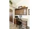 Dedicated office area with custom built-in cabinetry, granite countertops, and natural lighting at 8354 E Emelita Ave, Mesa, AZ 85208