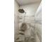 Close-up of the tile detailing in the shower with a mounted shower head at 8354 E Emelita Ave, Mesa, AZ 85208