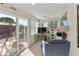Bright sunroom with sliding glass doors, tile flooring, ceiling fan, and plenty of natural light at 8354 E Emelita Ave, Mesa, AZ 85208
