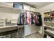 Organized walk-in closet with shelving, hanging rods, and space for shoe storage at 8354 E Emelita Ave, Mesa, AZ 85208