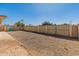 Wide view of the backyard with gravel, privacy walls, and a gate at 8648 N 37Th Ave, Phoenix, AZ 85051