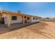 Backyard patio and a large, open area, with a wooden gate at 8648 N 37Th Ave, Phoenix, AZ 85051
