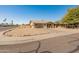 Single story home featuring low maintenance landscaping with a covered carport and quaint porch at 8648 N 37Th Ave, Phoenix, AZ 85051