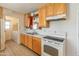 The kitchen features ample counter space and an adjoined laundry room at 8648 N 37Th Ave, Phoenix, AZ 85051