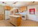Kitchen with an island and white appliances at 8648 N 37Th Ave, Phoenix, AZ 85051