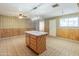 Spacious kitchen with island, white appliances, and ample counter space at 8648 N 37Th Ave, Phoenix, AZ 85051