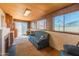 Comfortable living room featuring a plush sofa, a fireplace, and bright natural light from the windows at 8648 N 37Th Ave, Phoenix, AZ 85051