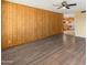 Inviting living area with wood-look floors, seamlessly flowing into the adjacent kitchen space at 8648 N 37Th Ave, Phoenix, AZ 85051
