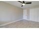 Bedroom features modern flooring, neutral walls, a ceiling fan, and closet space at 9437 E Champagne Dr, Sun Lakes, AZ 85248
