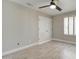Bright bedroom features wood-look flooring, natural light, and a spacious closet at 9437 E Champagne Dr, Sun Lakes, AZ 85248