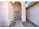 Welcoming entryway with arched opening, security screen door, and neutral tones at 9437 E Champagne Dr, Sun Lakes, AZ 85248
