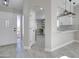 Inviting entryway with modern lighting, fresh paint, and sleek, hard surface floors at 9437 E Champagne Dr, Sun Lakes, AZ 85248