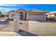 Charming single-story home featuring a well-maintained yard and a two-car garage at 9437 E Champagne Dr, Sun Lakes, AZ 85248