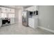 Modern open concept kitchen showcasing stainless steel appliances and updated countertops at 9437 E Champagne Dr, Sun Lakes, AZ 85248