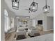 Stylishly furnished living room with contemporary decor, vaulted ceiling, and ample natural light at 9437 E Champagne Dr, Sun Lakes, AZ 85248