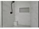 Updated shower stall featuring a sleek bench and marble-look tile, offering a spa-like experience at 9437 E Champagne Dr, Sun Lakes, AZ 85248