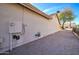 Side yard with gravel and utility connections at 9437 E Champagne Dr, Sun Lakes, AZ 85248