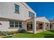 Exterior features an outdoor fireplace, covered patio, artificial turf and playground at 9729 E Theia Dr, Mesa, AZ 85212