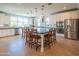 Bright, modern kitchen with stainless steel appliances, white cabinetry, and a large center island at 9729 E Theia Dr, Mesa, AZ 85212