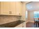 Modern kitchen design featuring granite countertops and stainless steel appliances at 9729 E Theia Dr, Mesa, AZ 85212
