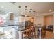 Bright kitchen features modern stainless appliances, white cabinetry and a large center island at 9729 E Theia Dr, Mesa, AZ 85212