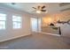 Spacious open loft area, with large windows, ceiling fan, and wrought iron railing at 9729 E Theia Dr, Mesa, AZ 85212