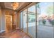 An indoor-outdoor transition through glass sliding doors to a paver patio at 9729 E Theia Dr, Mesa, AZ 85212