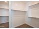 Well-organized walk-in closet with ample shelving and storage space, providing optimal organization at 9729 E Theia Dr, Mesa, AZ 85212