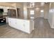 Eat in Kitchen with island and stainless steel appliances. Open to the living room at 10771 W Arvada Dr, Arizona City, AZ 85123