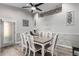 Elegant dining room with a stylish table, comfortable seating, and modern lighting at 11312 E Camino St, Mesa, AZ 85207