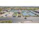 Aerial view of the community tennis and pickleball courts with convenient parking and seating areas at 11525 E Laguna Azul Cir, Mesa, AZ 85209