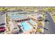 Aerial view of the community pool, lounge area, tennis courts, pickleball courts, and community building at 11525 E Laguna Azul Cir, Mesa, AZ 85209