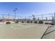 Outdoor basketball court with chainlink fencing surrounded by desert landscaping in active community at 11525 E Laguna Azul Cir, Mesa, AZ 85209