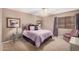 Comfortable bedroom with plush carpeting, a cozy bed, and soft lighting creating a relaxing atmosphere at 11525 E Laguna Azul Cir, Mesa, AZ 85209
