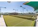 Well-maintained bocce ball court in a friendly community with lush green turf and lovely clubhouse at 11525 E Laguna Azul Cir, Mesa, AZ 85209