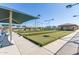 Well-maintained bocce ball courts with covered seating and landscaping at 11525 E Laguna Azul Cir, Mesa, AZ 85209