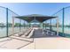 Covered seating area in fenced common area perfect for relaxing between tennis matches at 11525 E Laguna Azul Cir, Mesa, AZ 85209
