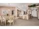 Open concept dining and kitchen with carpet flooring and ample natural light at 11525 E Laguna Azul Cir, Mesa, AZ 85209