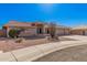 Charming single-story home featuring a three-car garage, tile roof, and desert landscaping at 11525 E Laguna Azul Cir, Mesa, AZ 85209