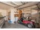 Functional garage featuring a golf cart, tools, and other garage storage amenities at 11525 E Laguna Azul Cir, Mesa, AZ 85209