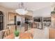 Open kitchen area with stainless steel appliances, wood cabinets, tile floor, and a breakfast nook at 11525 E Laguna Azul Cir, Mesa, AZ 85209