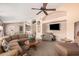 Spacious living room with comfortable seating, ceiling fan and views to other spaces at 11525 E Laguna Azul Cir, Mesa, AZ 85209