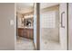 Spacious main bathroom with double sinks, a glass block shower, and ample natural light at 11525 E Laguna Azul Cir, Mesa, AZ 85209