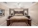 Elegantly decorated main bedroom featuring a comfortable bed, side tables with lamps, and soft neutral tones at 11525 E Laguna Azul Cir, Mesa, AZ 85209