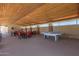 Community recreation room with ping pong table, seating and shade from the desert sun at 11525 E Laguna Azul Cir, Mesa, AZ 85209
