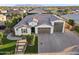 Stunning aerial view of a home showcasing its manicured landscaping, tile roof, and desirable neighborhood location at 12539 W Tuckey Ln, Glendale, AZ 85307